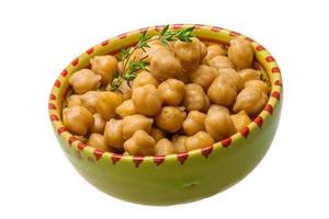 Chickpea in a bowl on white background photo