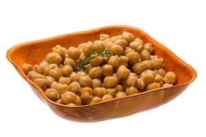 Chickpea in a bowl on white background photo