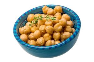 Chickpea in a bowl on white background photo