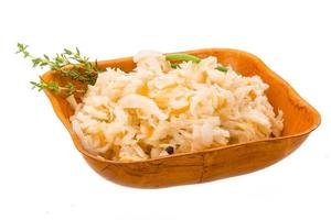 Fermented Cabbage in a bowl on white background photo