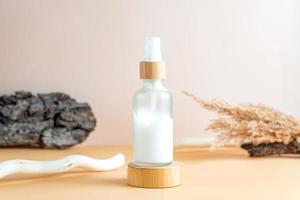 White frosted glass cosmetic cream bottle with bark of the tree, wood branch. SPA natural organic beauty product packaging design