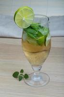 Mojito on wooden background photo