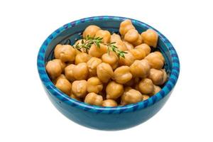 Chickpea in a bowl on white background photo