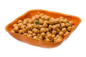 Chickpea in a bowl on white background photo