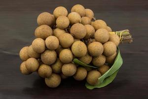 Longan on wooden background photo