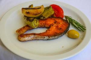 Grilled salmon on the plate photo