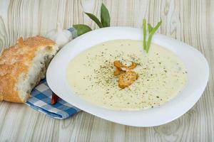 Cheese soup with croutons photo