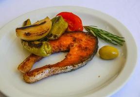 Grilled salmon on the plate photo