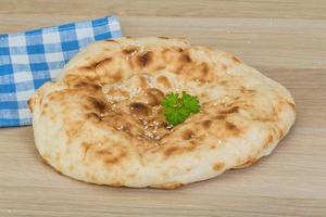 Armenian bread on wooden background photo