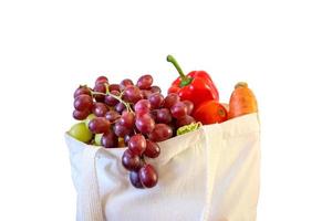 Fresh fruits and vegetables grocery product in reusable shopping bag isolated on white background with clipping path photo