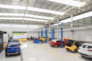 car service centre with auto at repair station bokeh light defocused blur background photo