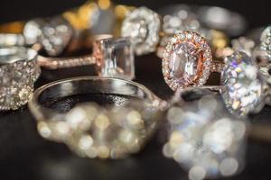 Jewelry rings on black background close up photo