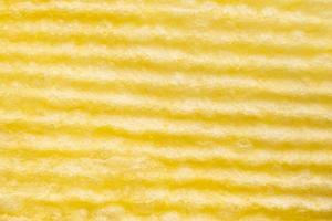 Potato chip texture background closeup photo