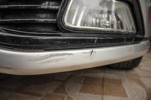 car bumper scratched paint damage photo