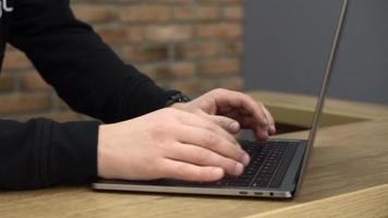 Close up of hands typing on laptop computer video