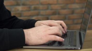 Close up of hands typing on laptop computer video