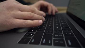 Close up of hands typing on laptop computer video