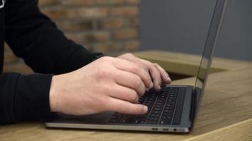 Close up of hands typing on laptop computer video