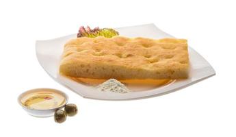 Olive bread on the plate and white background photo