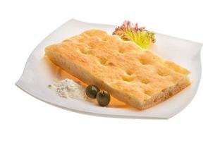 Olive bread on the plate and white background photo