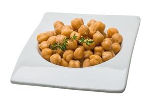 Chickpea in a bowl on white background photo