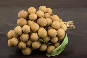 Longan on wooden background photo