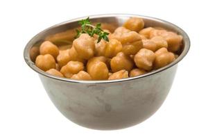 Chickpea in a bowl on white background photo