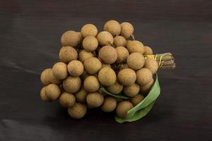 Longan on wooden background photo