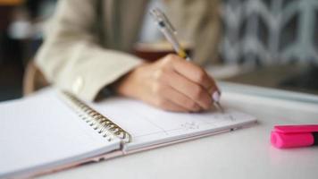 Woman hand writing on notebook video