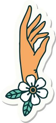 sticker of tattoo in traditional style of a hand and flower