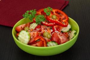 Salad on wooden background photo