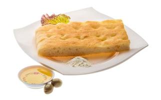 Olive bread on the plate and white background photo