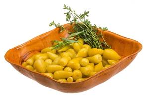 Marinated pepper in a bowl on white background photo