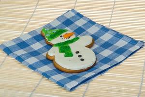 Christmas gingerbread on wooden background photo