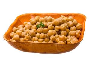 Chickpea in a bowl on white background photo