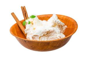 Cottage cheese in a bowl on white background photo