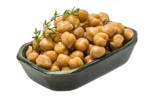 Chickpea in a bowl on white background photo