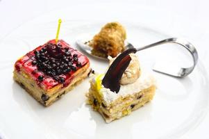 Mini cakes on the plate photo