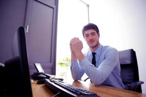 happy young business man at office photo