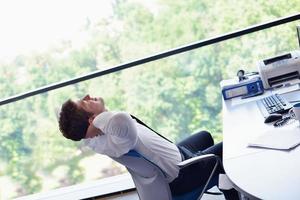 happy young business man at office photo