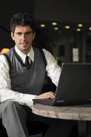 young businessman working on laptop photo