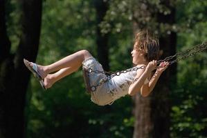 happy girl swinging photo