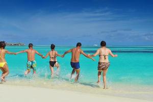 group of happy young people have fun on bach photo