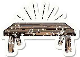 worn old sticker of a tattoo style wood table vector