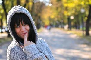 brunette Cute young woman smiling outdoors photo