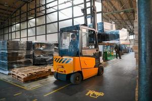 Turkey, 2022 - Forklift loader in storage warehouse ship yard. Distribution products. Delivery. Logistics. Transportation. Business background photo