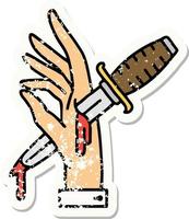 distressed sticker tattoo in traditional style of a dagger in the hand vector