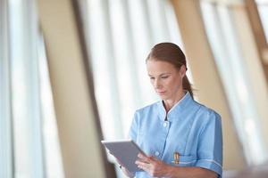 female doctor with tablet computer photo