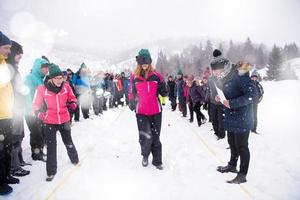 group of young people having blindfolded games competition photo