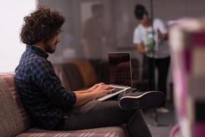 man working with laptop photo